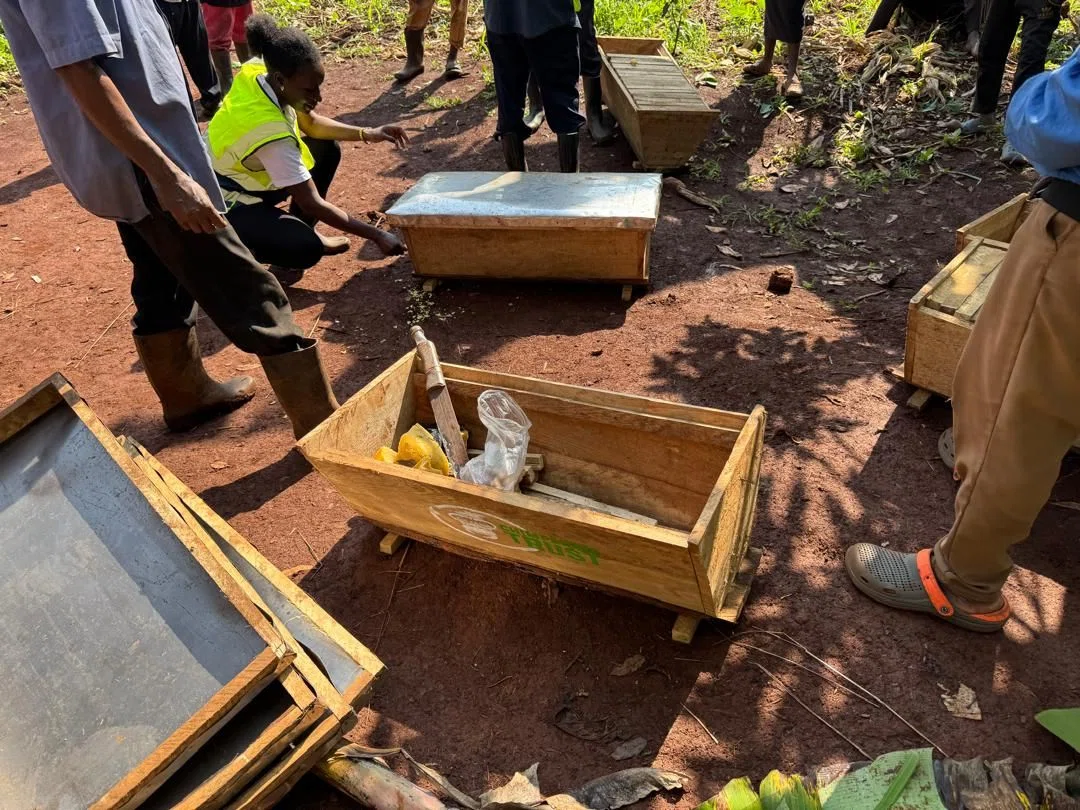 Farmers assembling Kenya Top Bar beehive frames